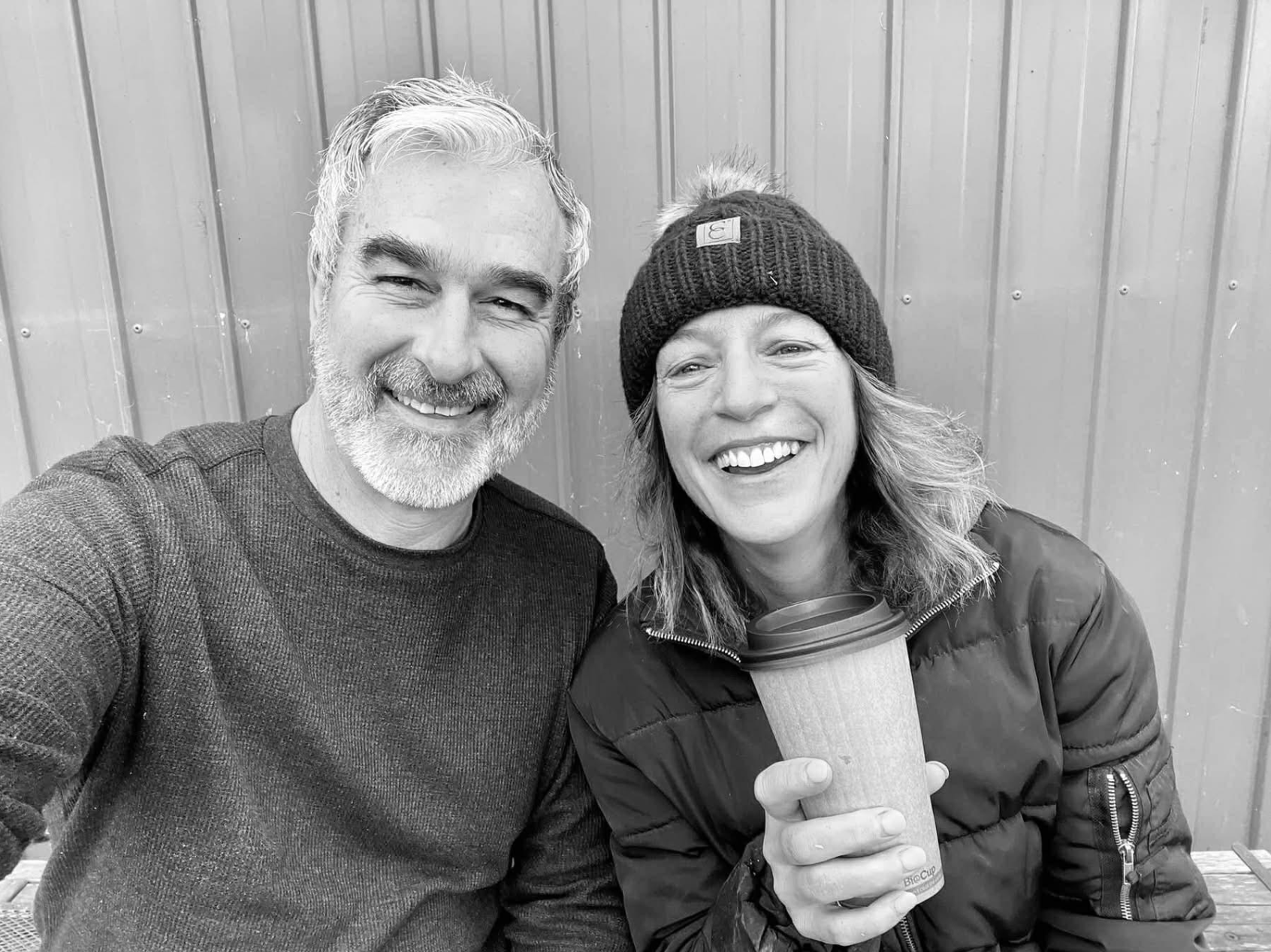The founders at the stables, coffee in hand